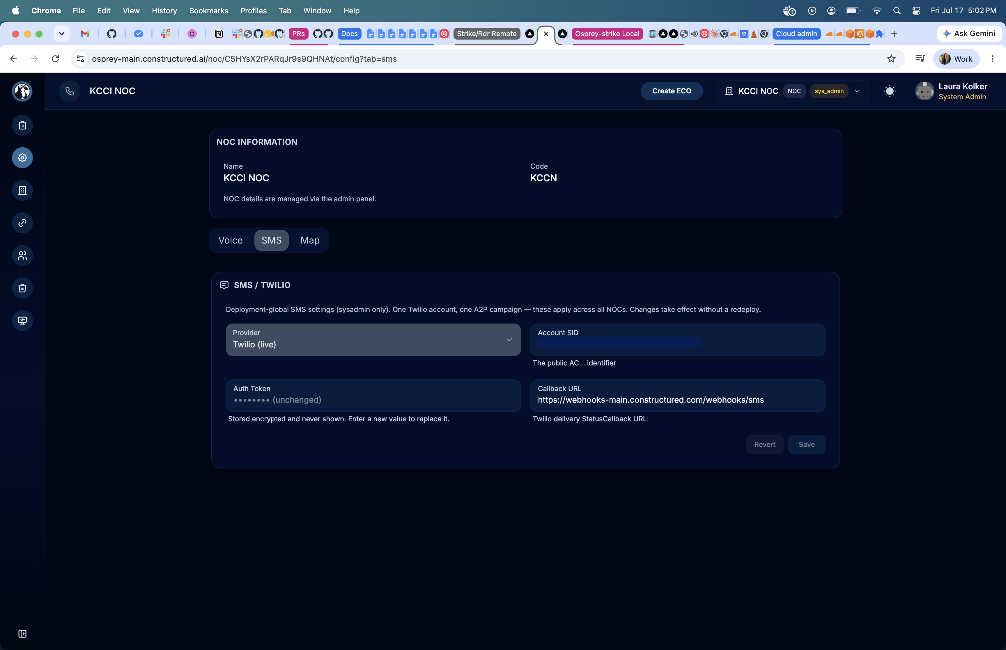 Osprey Strike System Configuration SMS tab showing Twilio live provider, account SID, masked auth token, and callback URL set to https://webhooks-main.constructured.com/webhooks/sms
